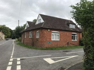 Red brick dormer bungalow conversion.